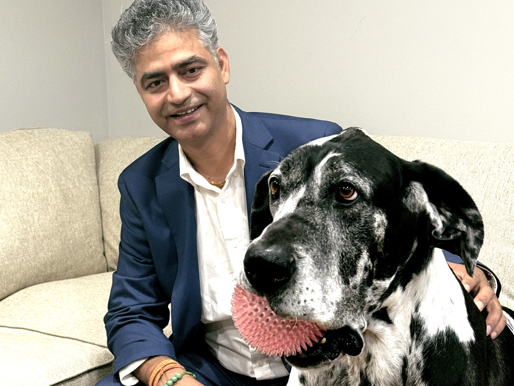 Satish Chapagain at home with his dog